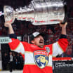 Brad Marchand lifts Stanley Cup again after 14 years